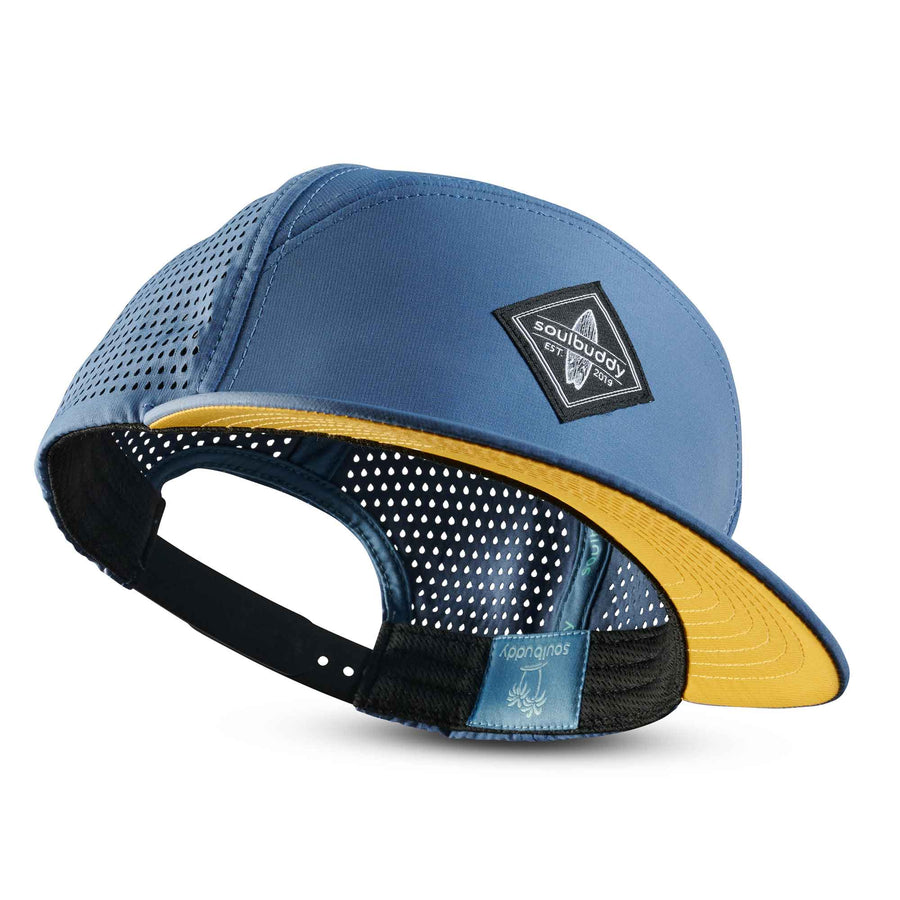 Blaue Performance Snapback Cap mit Mesh-Einsätzen und gelbem Schirm im modernen Soulbuddy Design
